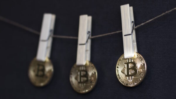 How do scammers launder stolen bitcoin